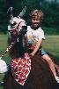boy riding a llama